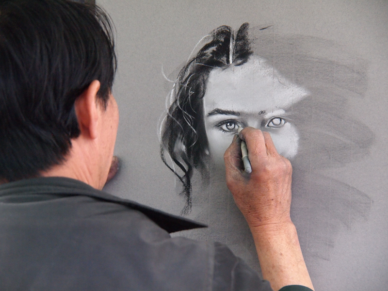 artist drawing sketch of woman