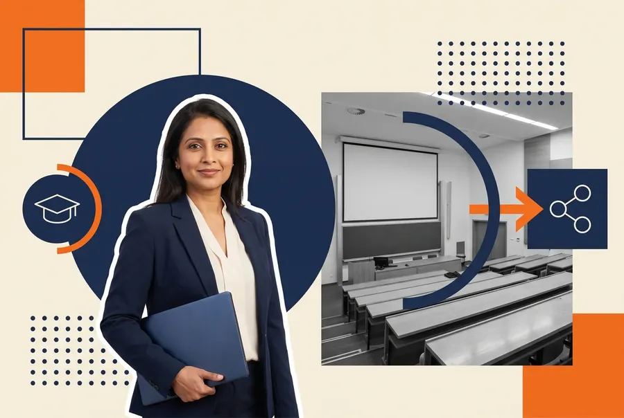 Academic technology director holding a laptop beside a university lecture theatre