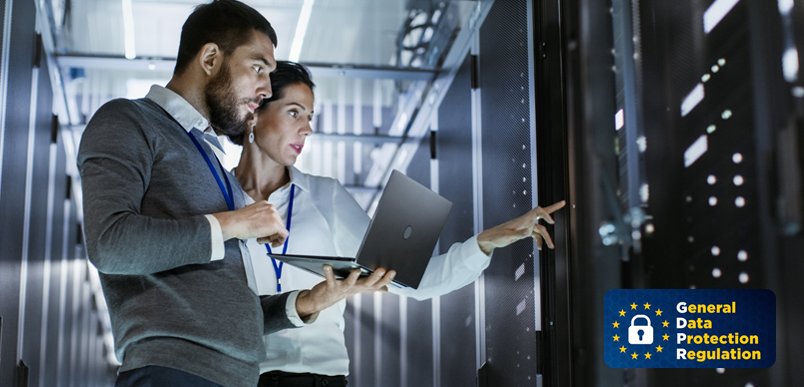 IT professionals working in server room with GDPR compliance logo visible.